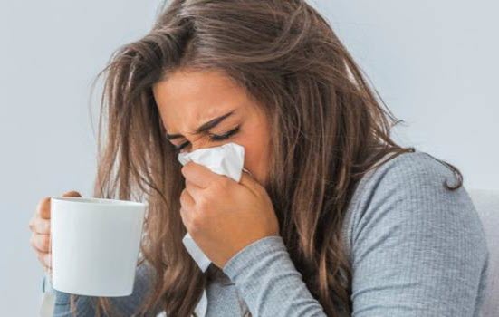 woman-covering-nose-with-tissue